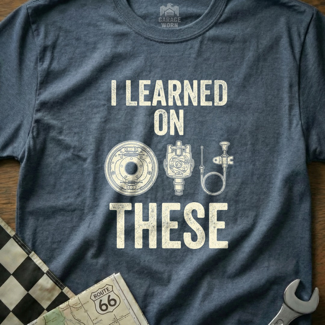 T-shirt with "I LEARNED ON THESE" and illustrations of car parts.