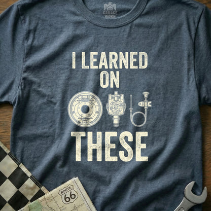 T-shirt with "I LEARNED ON THESE" and illustrations of car parts.