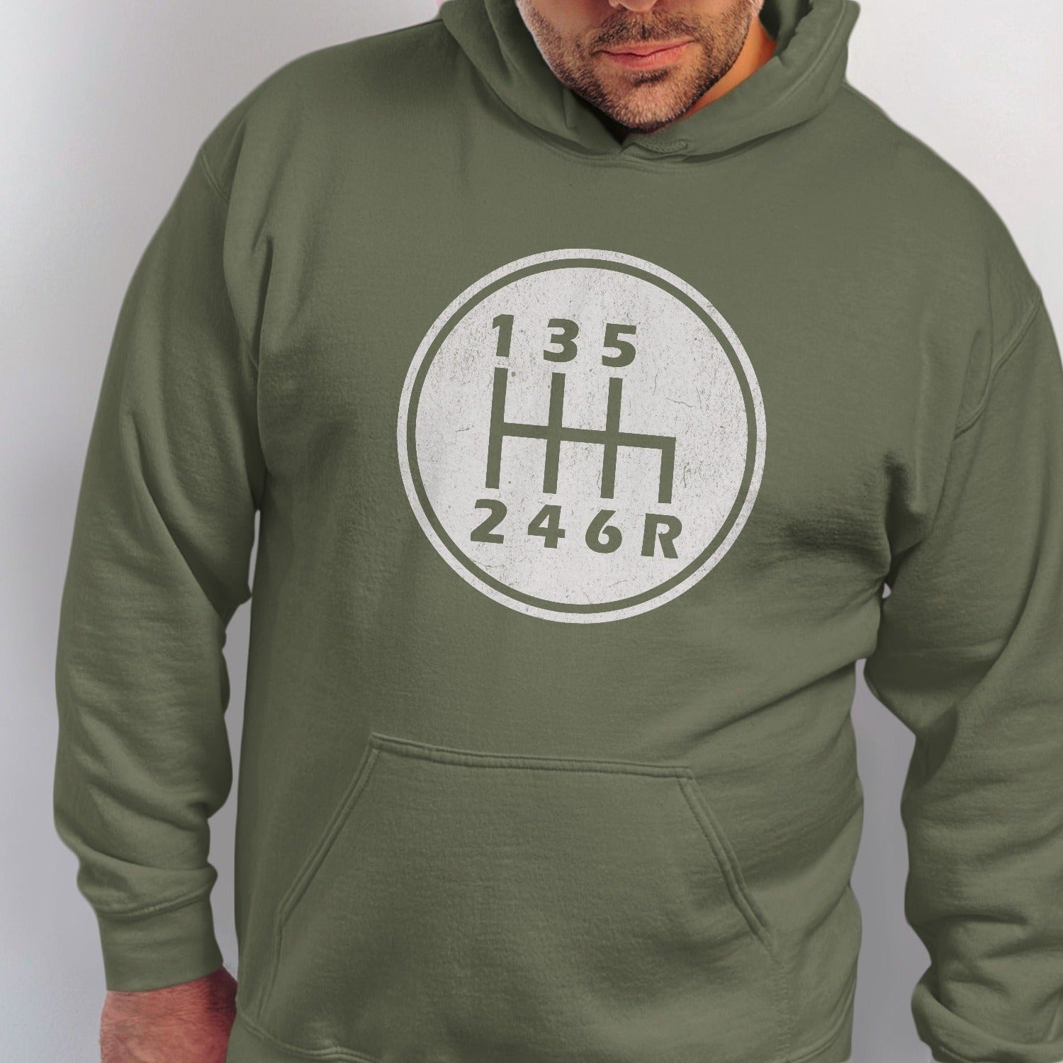 Green hoodie with a circular graphic of a six-speed manual transmission shift pattern.