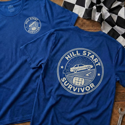 Blue t-shirt with "Hill Start Survivor" text and car graphic on back.