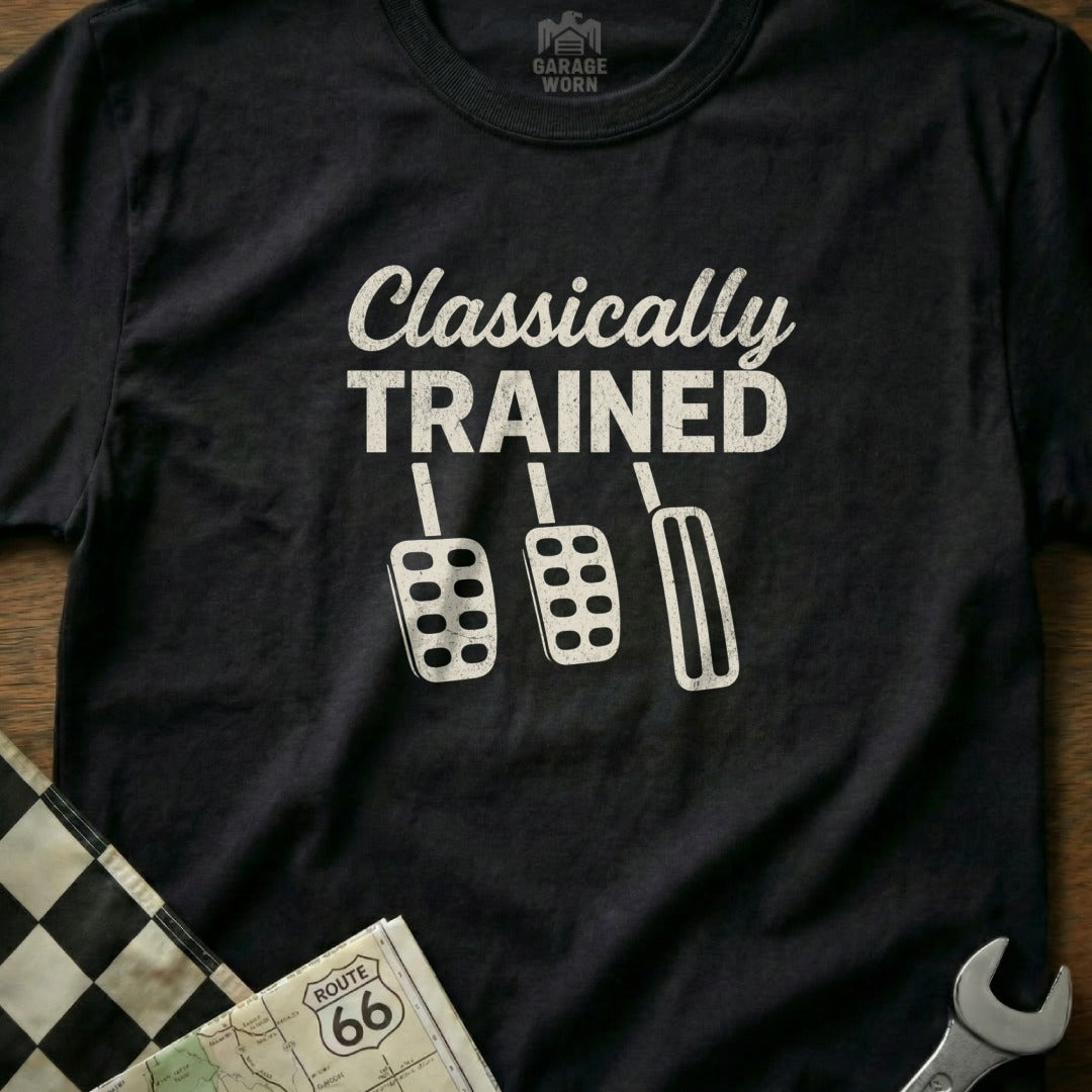 Black t-shirt with white graphic of car pedals and "Classically Trained" text.