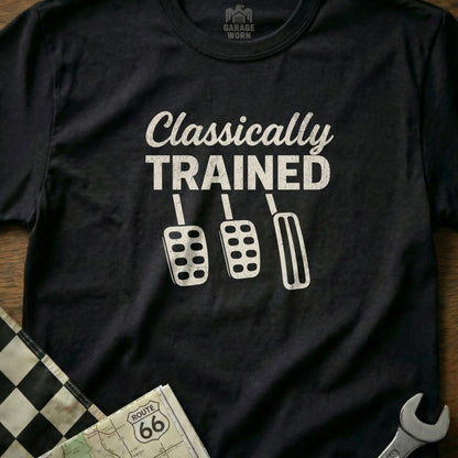 Black t-shirt with white graphic of car pedals and "Classically Trained" text.