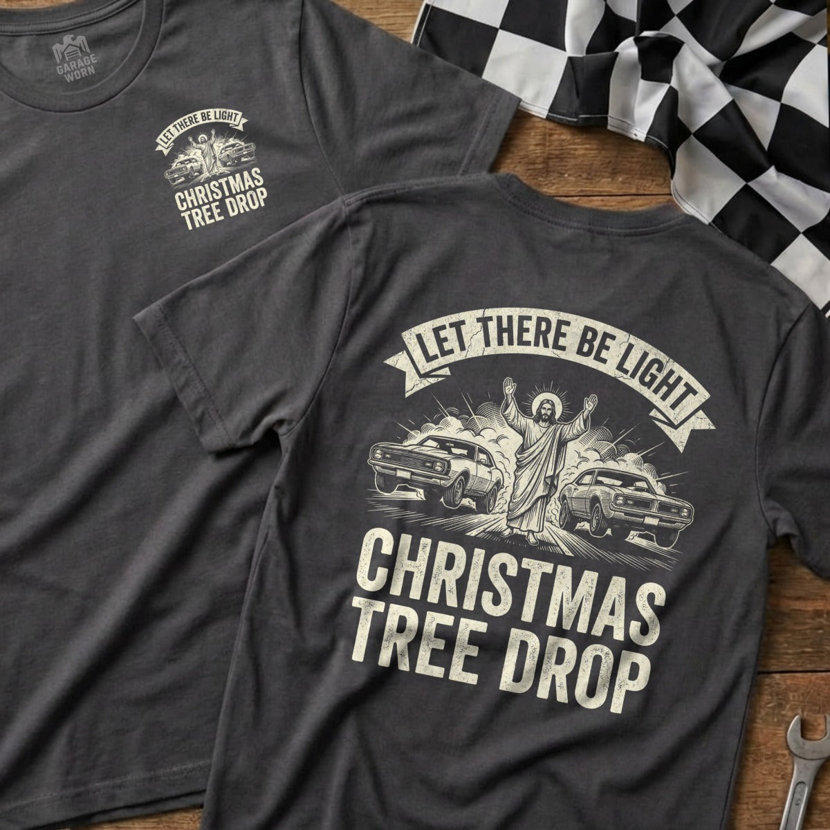 Dark t-shirt featuring Jesus between two muscle cars with text "Christmas Tree Drop".