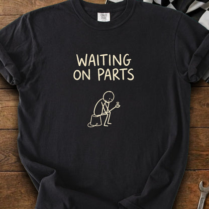 Black t-shirt with "WAITING ON PARTS" and stick figure holding a screw.