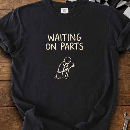 Black t-shirt with "WAITING ON PARTS" and stick figure holding a screw.