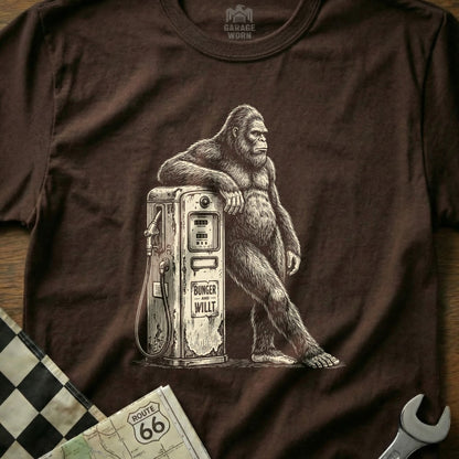 Bigfoot leaning on a vintage gas pump with "Bunger and Willt" text.