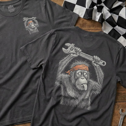Dark gray t-shirt with illustration of an orangutan holding a wrench, tongue out.