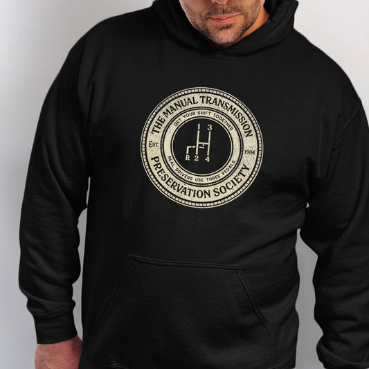 Black hoodie with "The Manual Transmission Preservation Society" circular graphic.