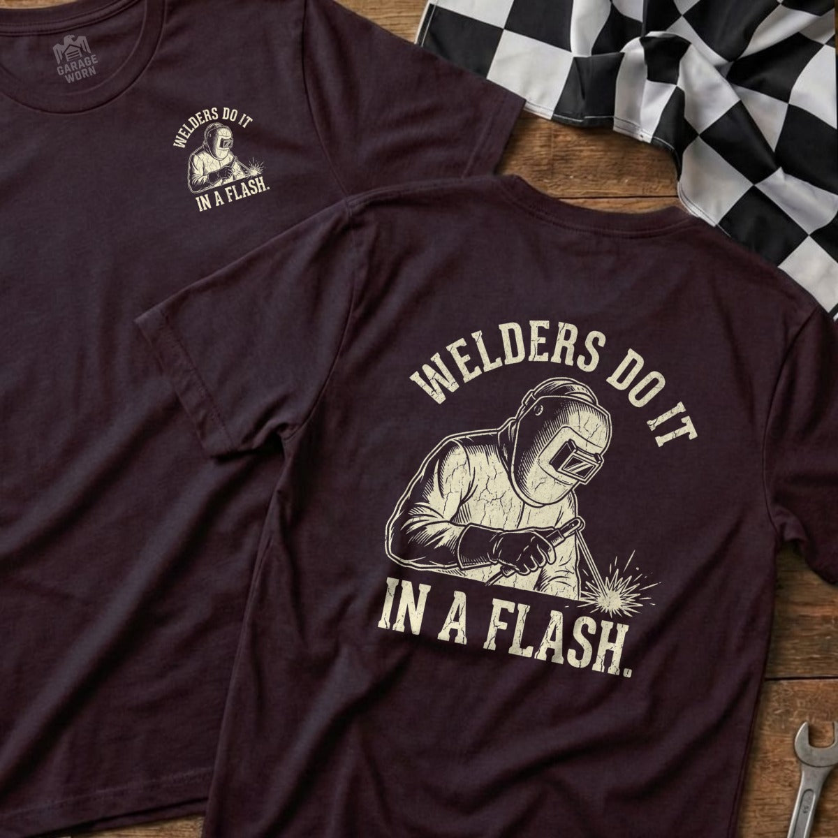 Maroon t-shirt with graphic of welder and text "WELDERS DO IT IN A FLASH."