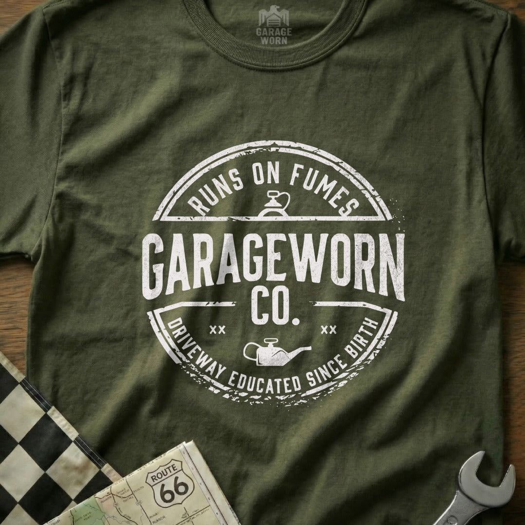 GarageWorn Co. t-shirt with "Runs on Fumes" and "Driveway Educated Since Birth" text.