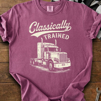 Burgundy t-shirt with white distressed graphic of a semi-truck and text "Classically TRAINED".