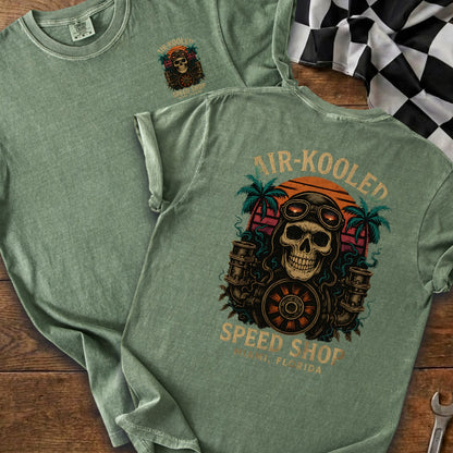 Green t-shirt with "AIR-KOOLED SPEED SHOP" graphic featuring a skull, engines, and palm trees.