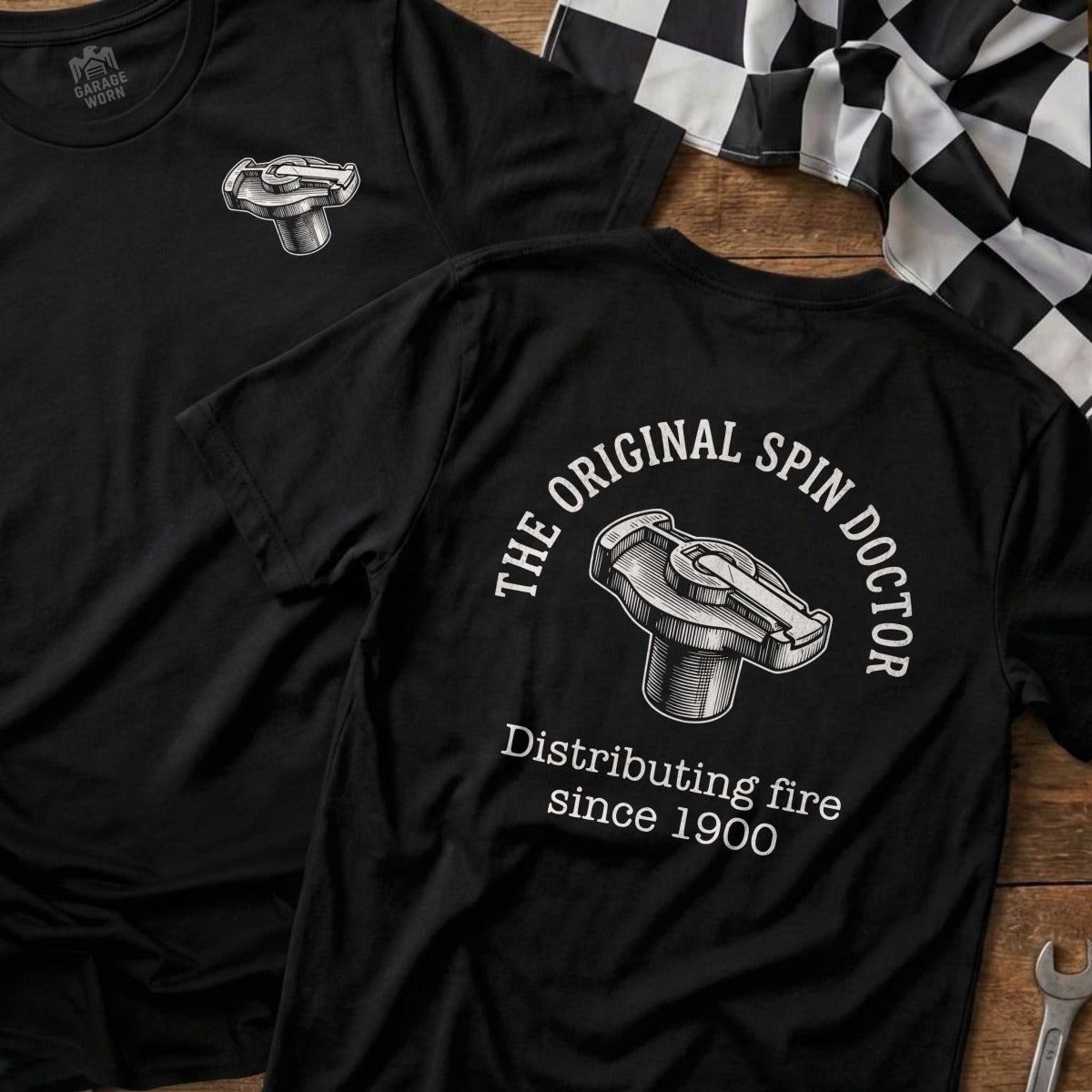 Black t-shirt with "The Original Spin Doctor" and "Distributing fire since 1900" text.