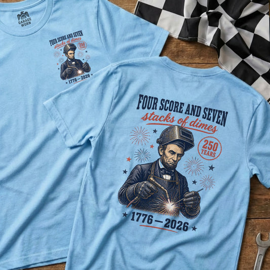 Light blue t-shirt with Abraham Lincoln welding, "250 Years" and "1776-2026".