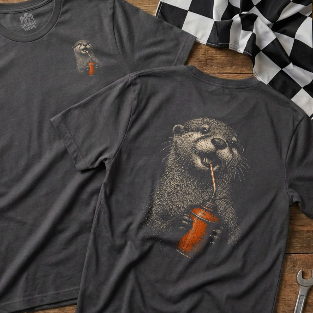 Dark grey t-shirt with a drawing of an otter drinking from an oil can.
