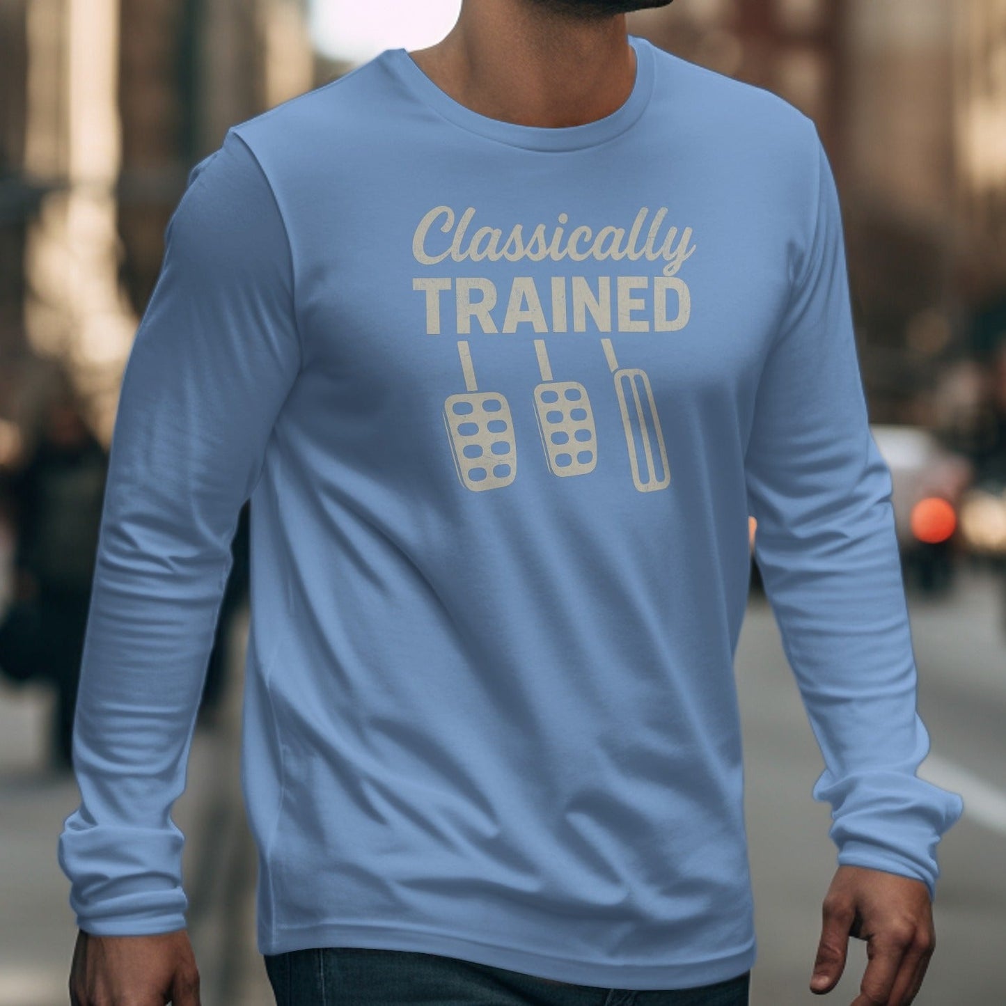 Blue long-sleeve shirt with text "Classically TRAINED" and three clutch pedals.