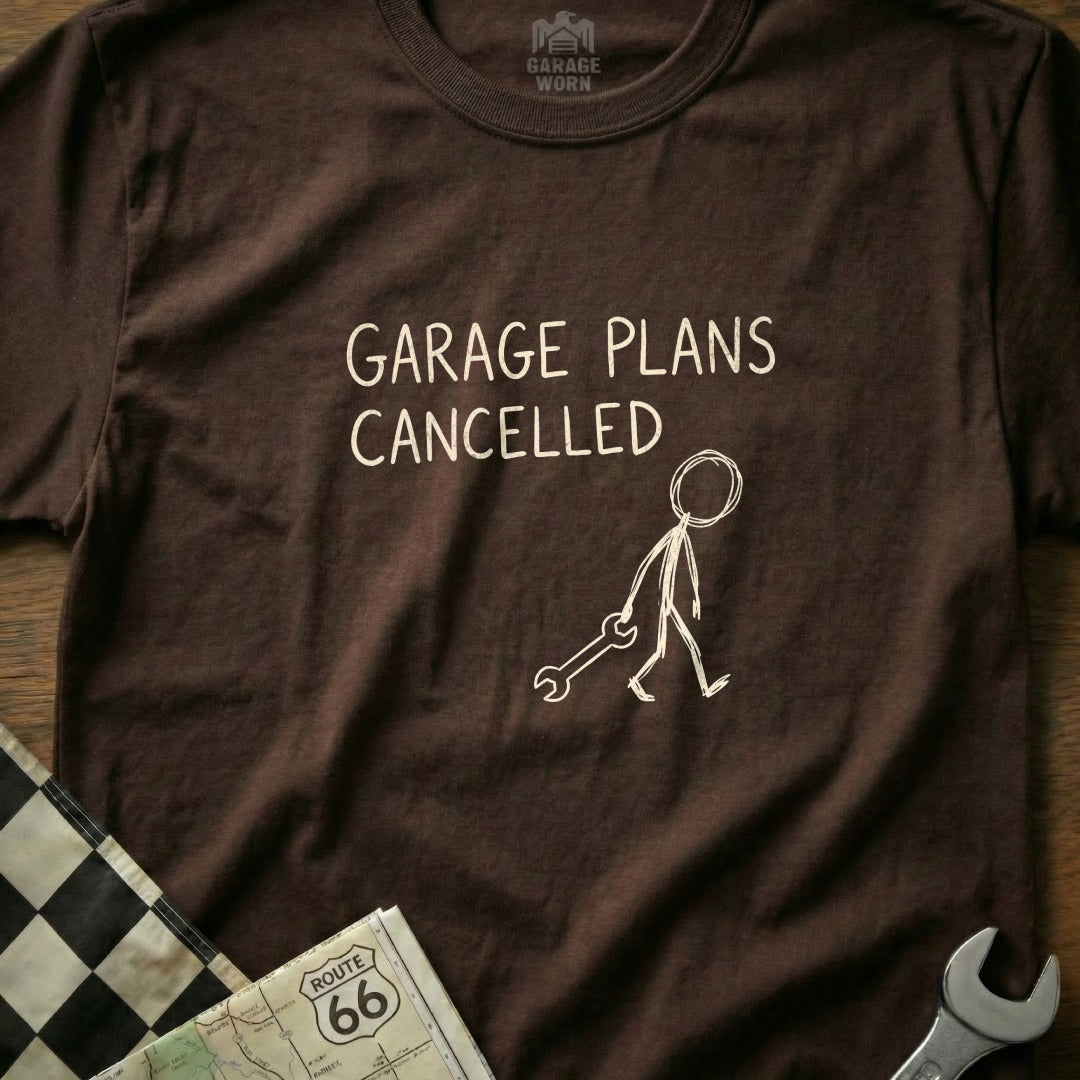Brown t-shirt with "GARAGE PLANS CANCELLED" and stick figure holding a wrench.
