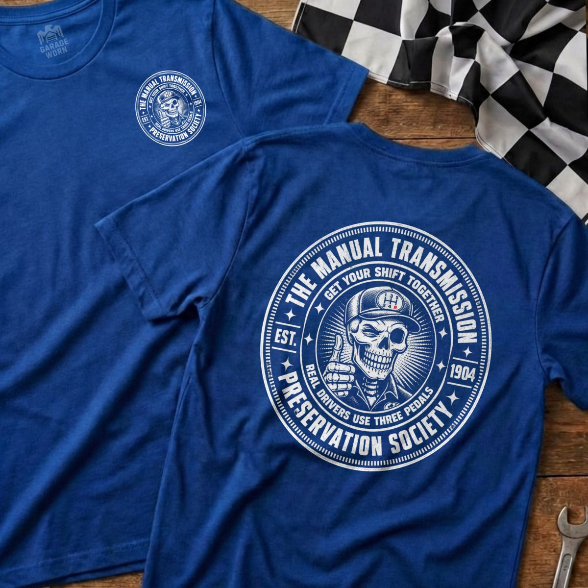 Blue t-shirt with "The Manual Transmission Preservation Society" graphic.