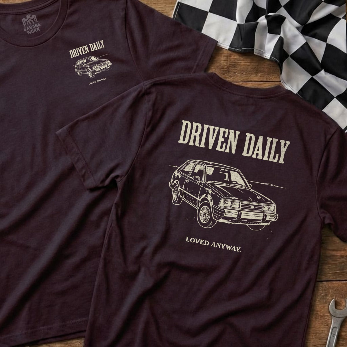 Burgundy t-shirt with "Driven Daily" and a classic car graphic.