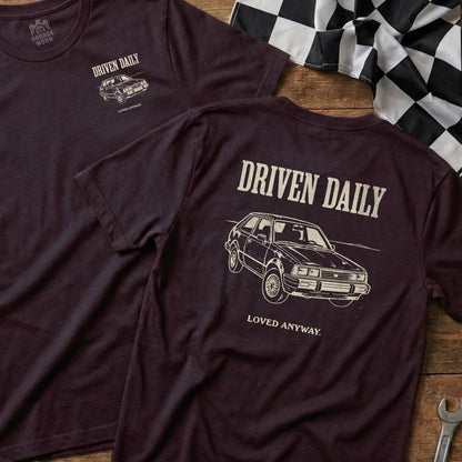 Burgundy t-shirt with "Driven Daily" and a classic car graphic.