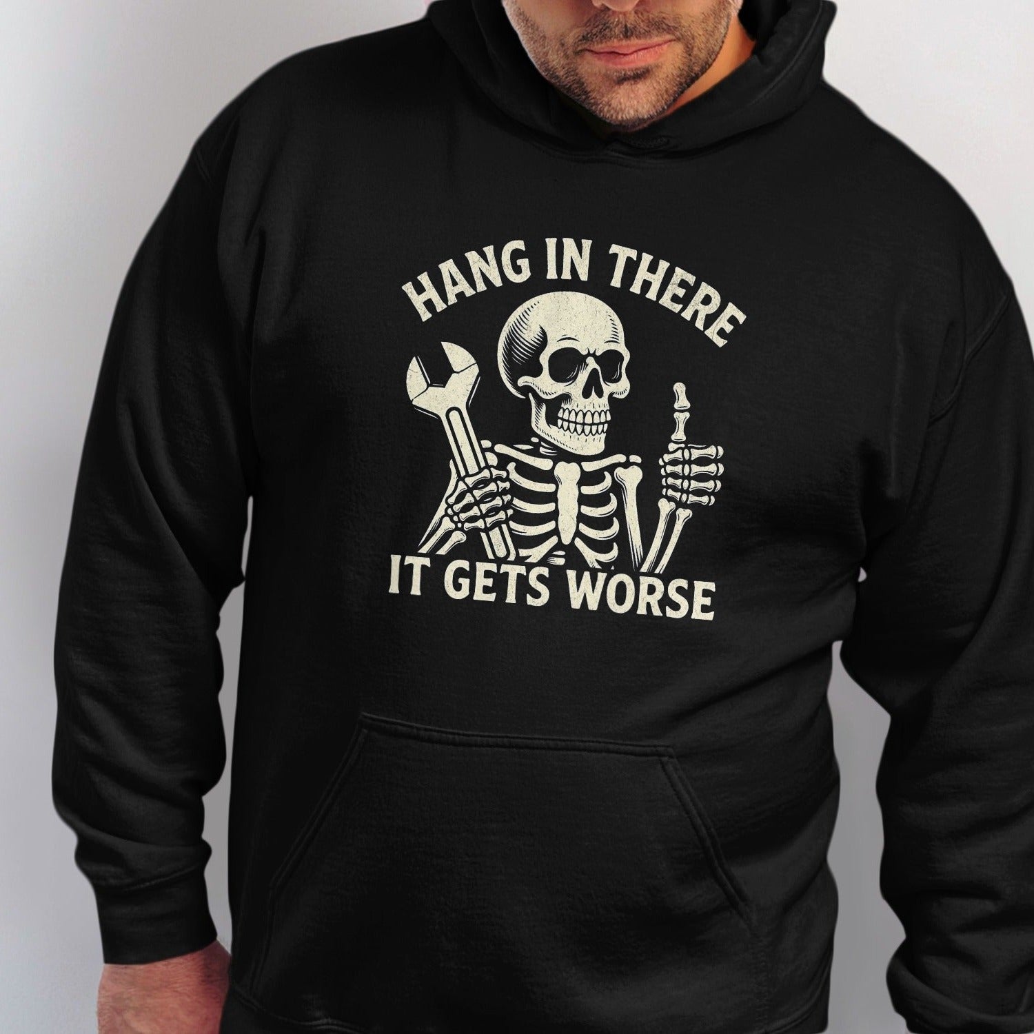 Skeleton holding wrench and giving thumbs up, text "Hang in there, it gets worse."