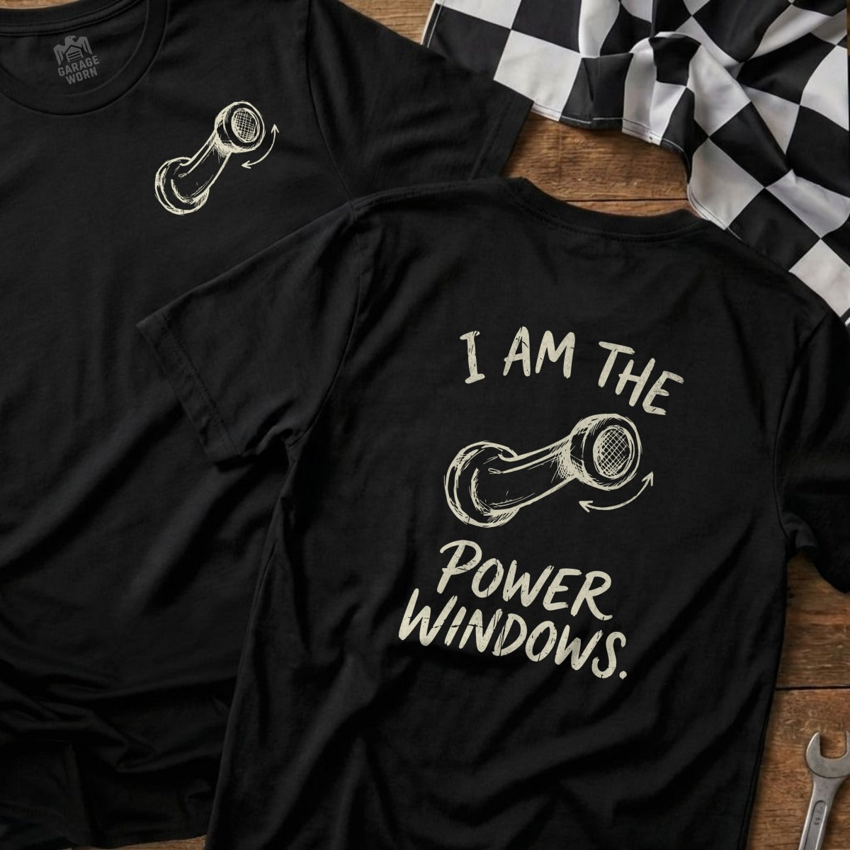 Black t-shirt with a graphic of a piston and the text "I AM THE POWER WINDOWS."