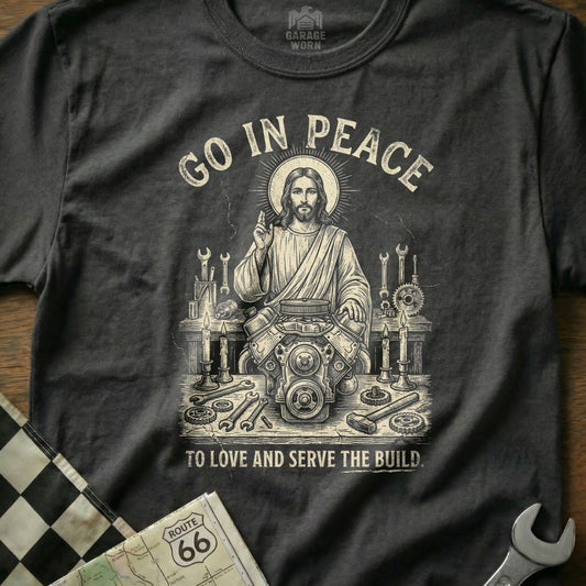 Jesus with tools and engine, "Go in Peace to Love and Serve the Build."