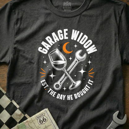 T-shirt with "Garage Widow Est. The Day He Bought It" text, wine glass, and wrench graphic.