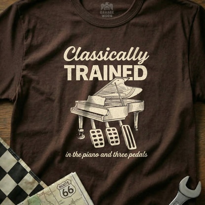 Brown t-shirt with "Classically Trained in the piano and three pedals" and a piano graphic.