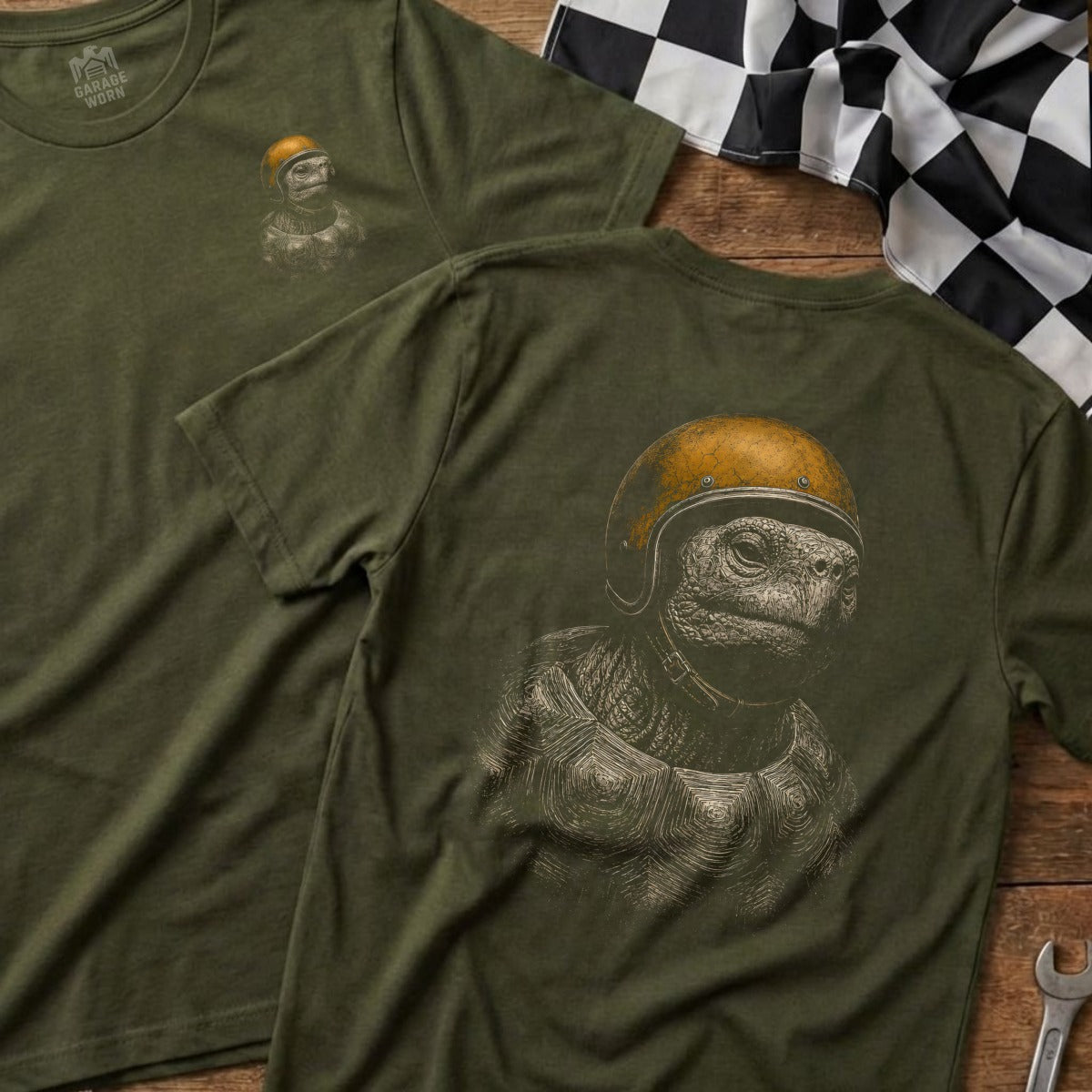 Olive green t-shirt with tortoise wearing a helmet graphic on the back.