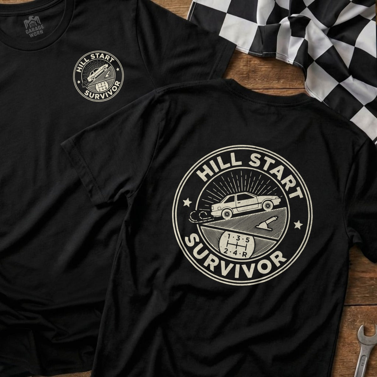 Black t-shirt with "Hill Start Survivor" graphic on back and matching shirt on left.