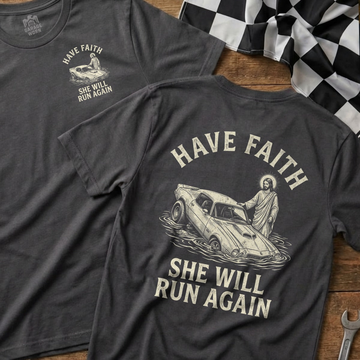 Dark t-shirt with "HAVE FAITH SHE WILL RUN AGAIN" and image of Jesus in a car.