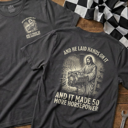 Jesus working on an engine with "And he laid hands on it and it made 50 more horsepower" text.