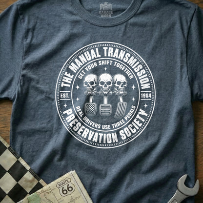 Manual Transmission Preservation Society shirt with skulls on pedals.