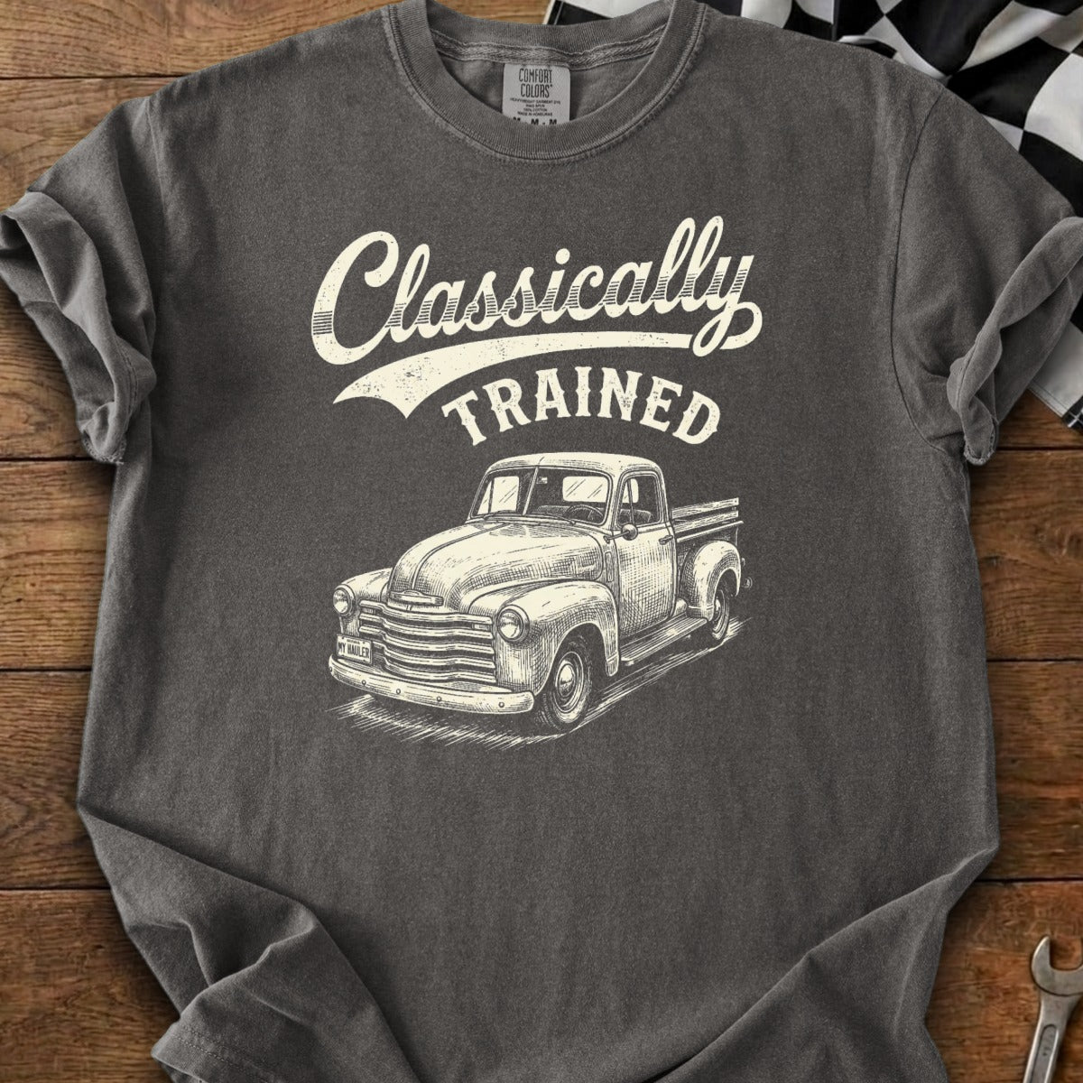 Graphite t-shirt with "Classically TRAINED" text and a sketch of a vintage pickup truck.