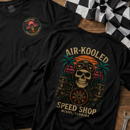 Black t-shirts featuring skull, motorcycle wheel, and "Air-Kooled Speed Shop" text.