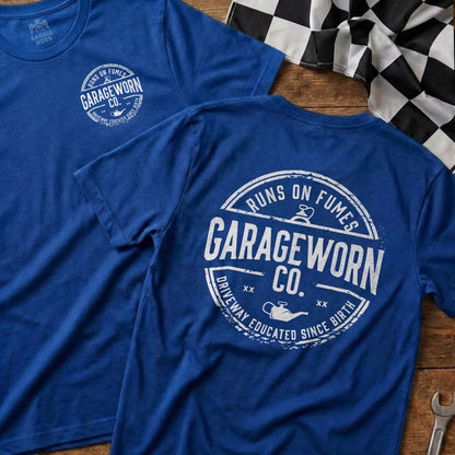 Blue t-shirt with "GarageWorn Co. Runs on Fumes Driveway Educated Since Birth" on back.