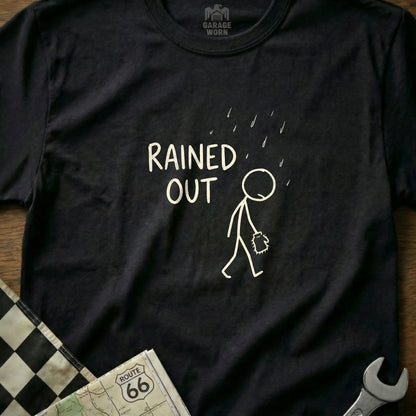Black t-shirt with a stick figure walking in the rain and text "RAINE D OUT".