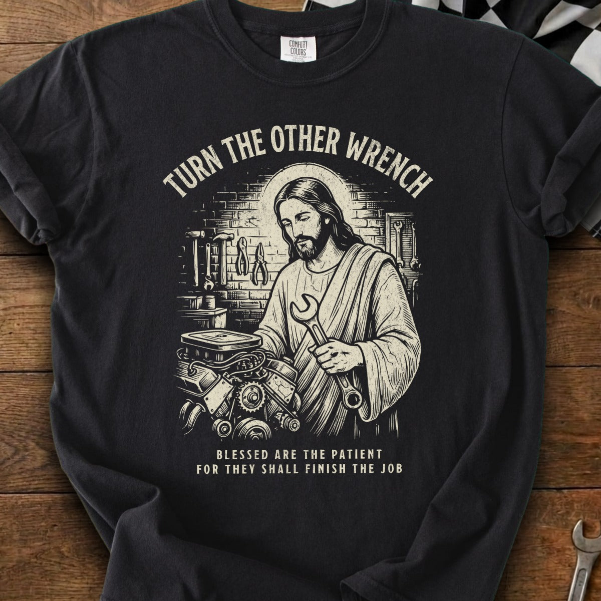 Jesus works on an engine with "Turn the other wrench" and slogan.