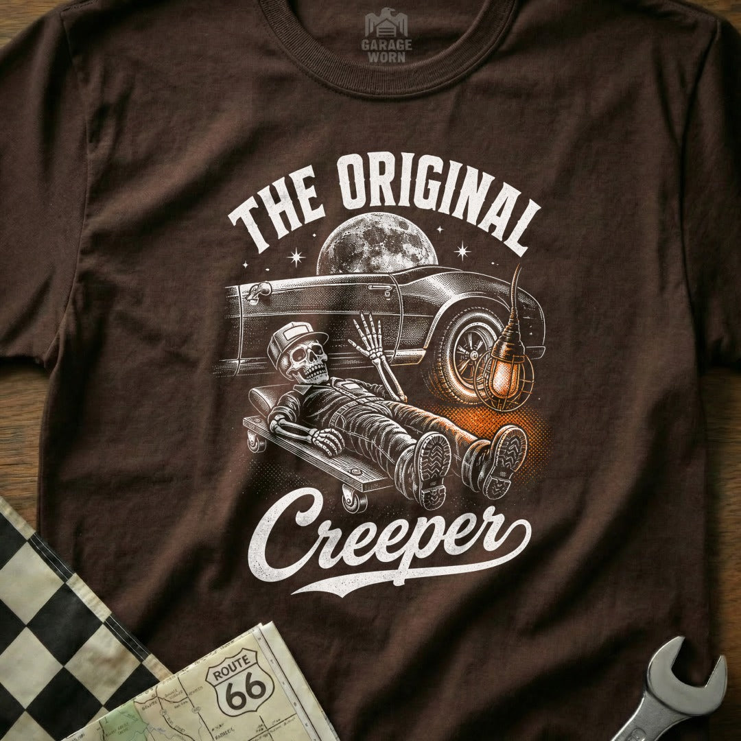 Skeleton on creeper under a car with moon and "The Original Creeper" text.