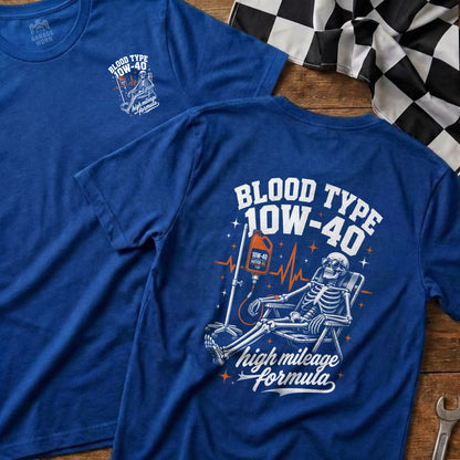 Blue t-shirt with skeleton on IV drip, "Blood Type 10W-40 High Mileage Formula" text.