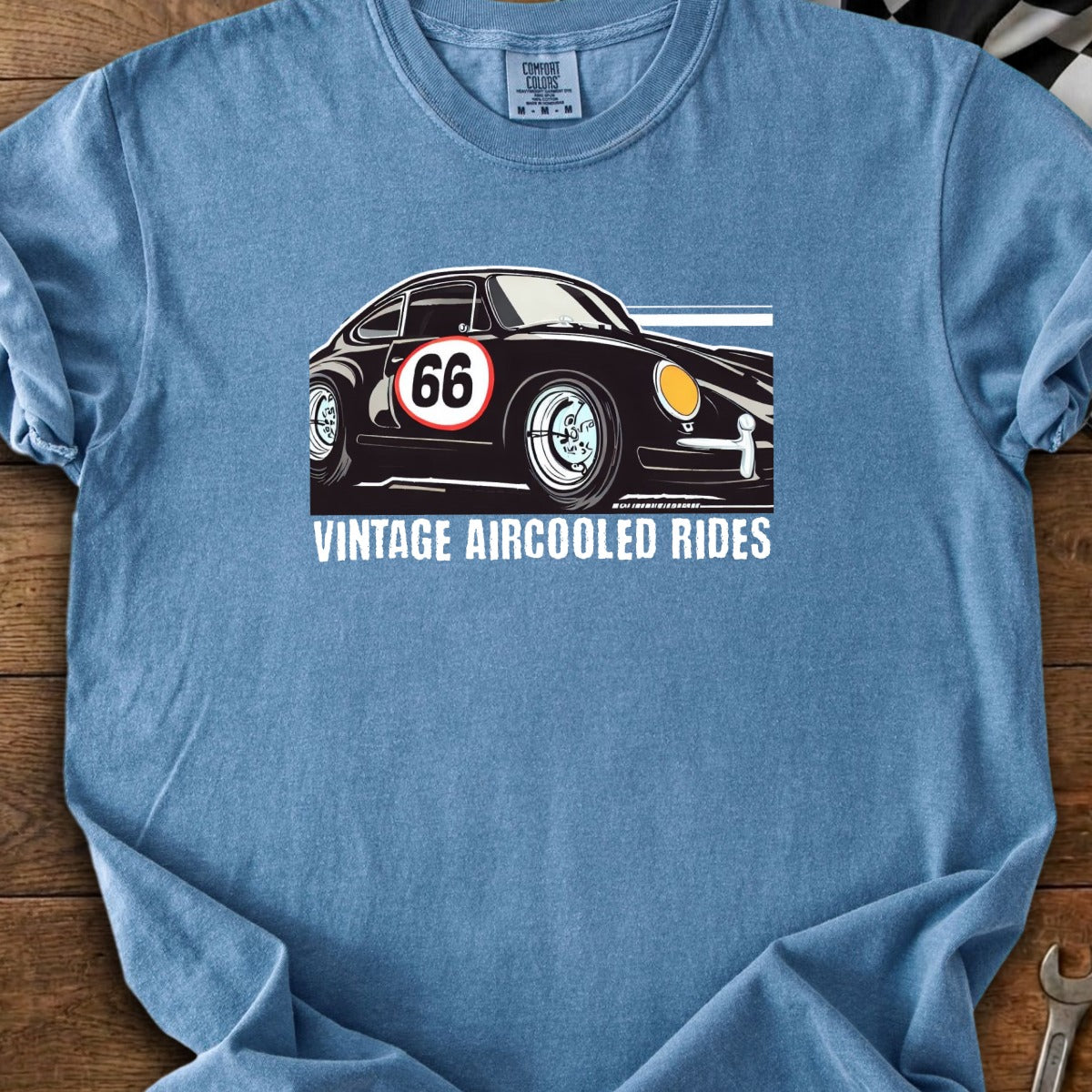 Black vintage car with number 66 on a blue t-shirt with text "Vintage Aircooler Rides".