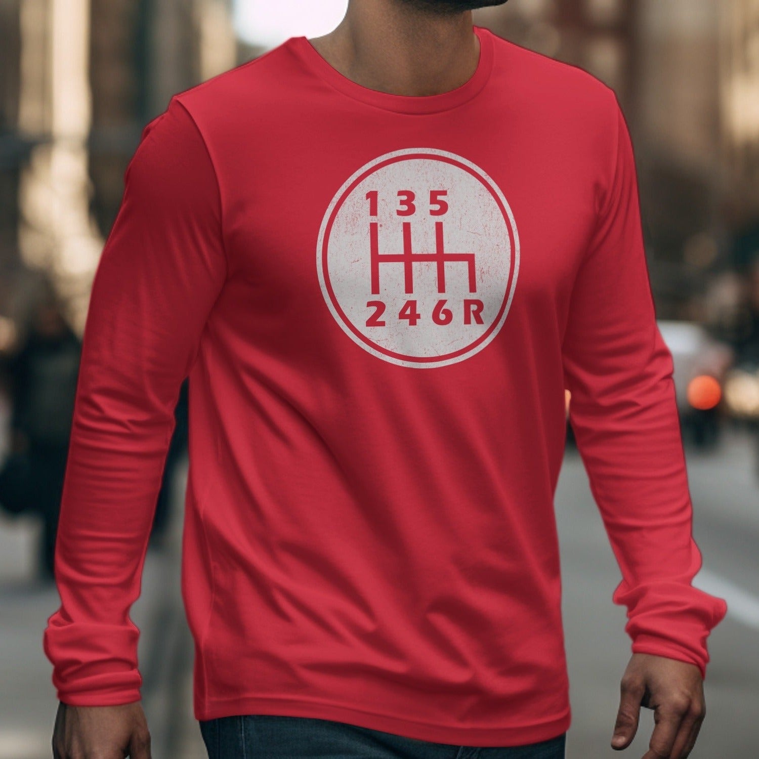 Red long-sleeve shirt with a manual transmission shift pattern graphic.
