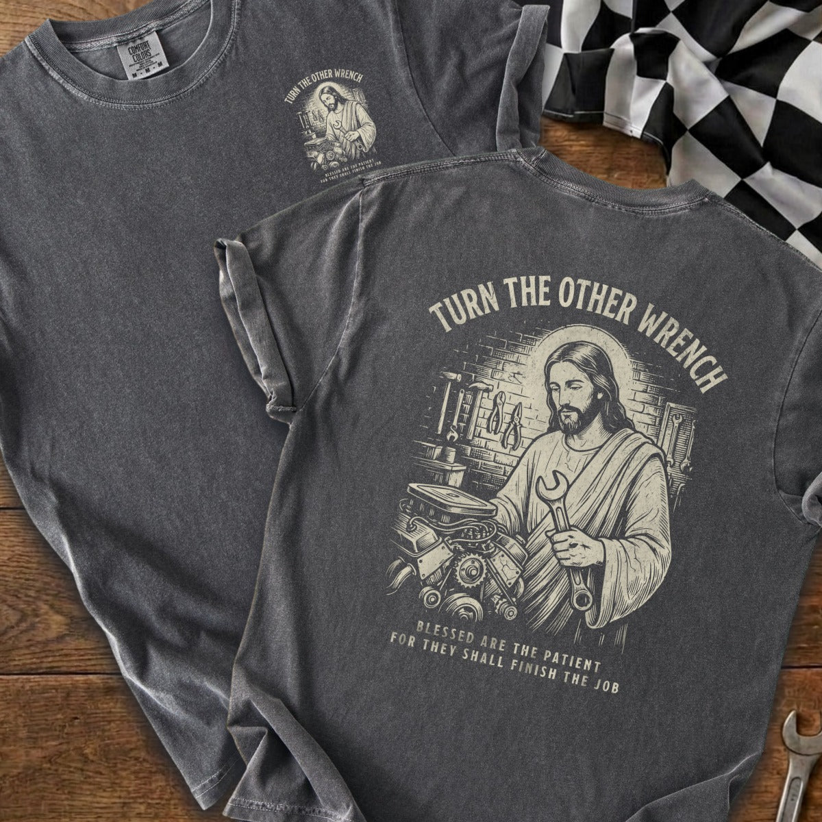 Jesus holding a wrench and engine parts with text "Turn the Other Wrench".
