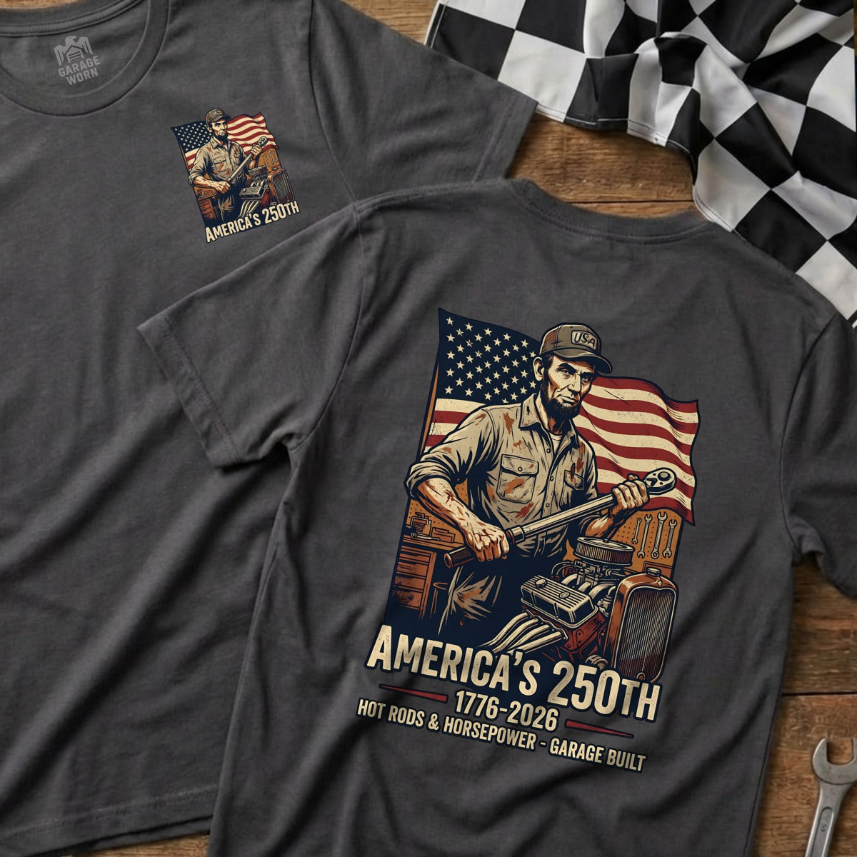 Dark gray t-shirt with patriotic hot rod mechanic graphic and "America's 250th" text.