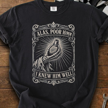 Black t-shirt with skeleton hand holding 10mm socket and text "Alas, Poor 10mm, I Knew Him Well".