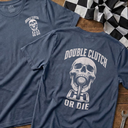 Skull graphic with gear shift and text "Double Clutch Or Die" on blue t-shirt.