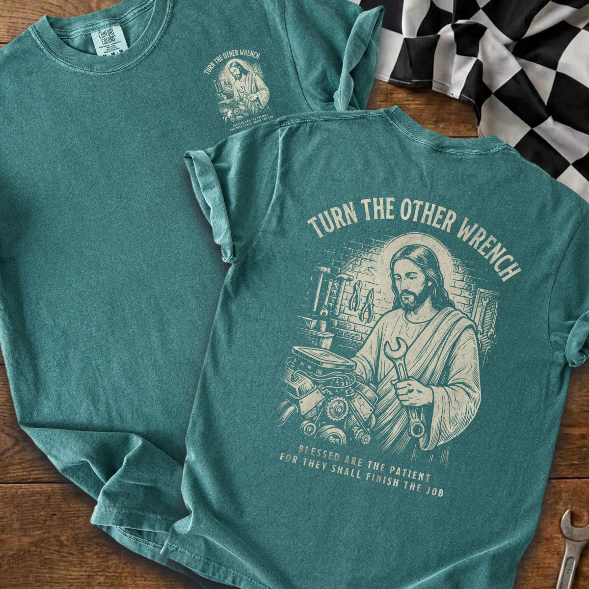 Jesus holding a wrench with tools, engine. "Turn the Other Wrench" text.