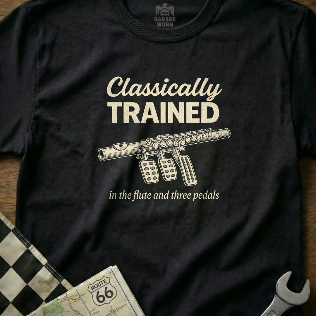 Black t-shirt with "Classically Trained in the flute and three pedals" and flute illustration.