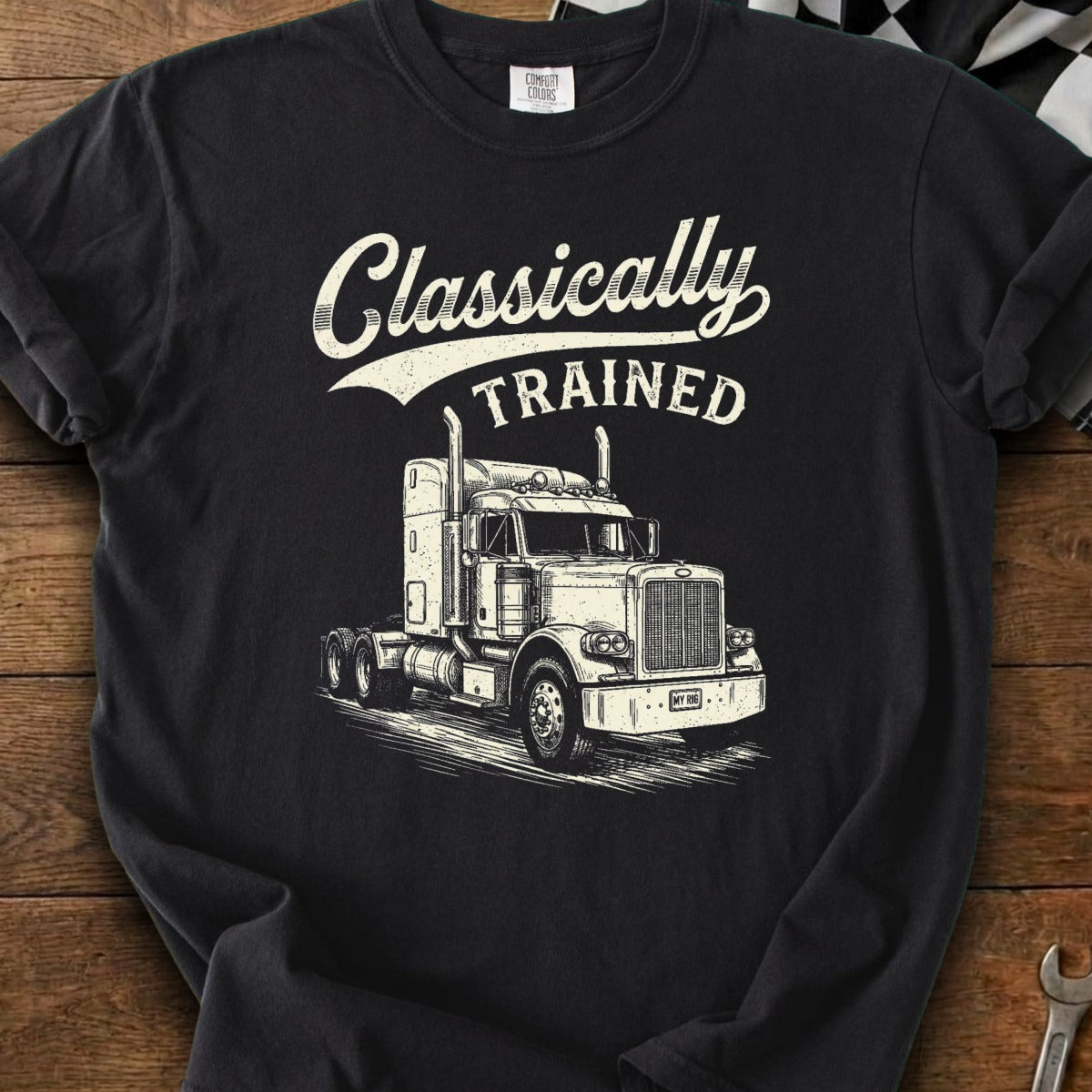 Black t-shirt with "Classically TRAINED" text and a detailed illustration of a semi-truck.